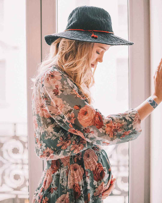 Beautiful expecting mom with Blisslets acupressure bands for anxiety relief